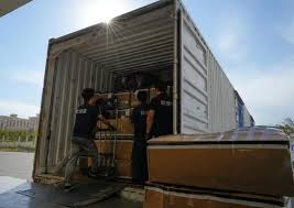 A freight train, loaded with daily necessities, vehicle parts and ...